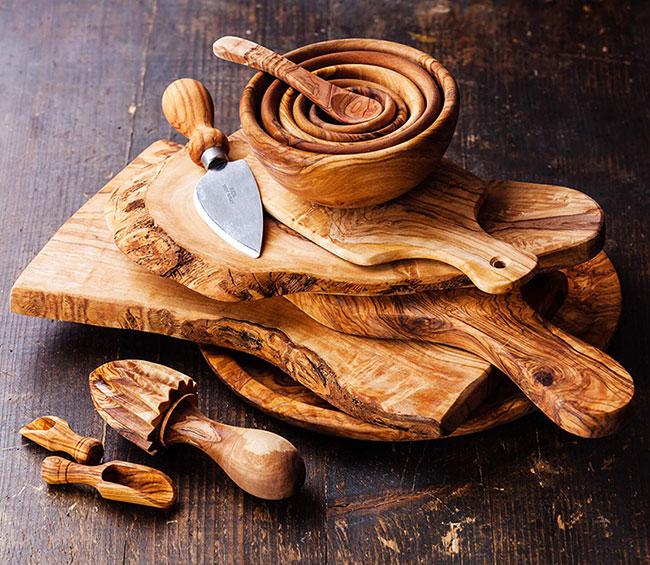 Chopping boards and other kitchen implements made from olive wood.