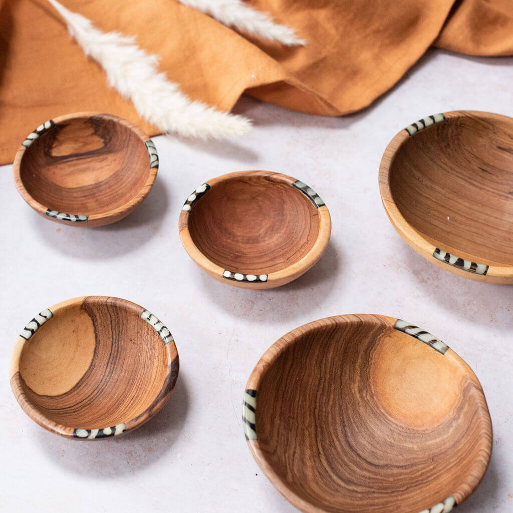 African olive wood bowls with bone insets.