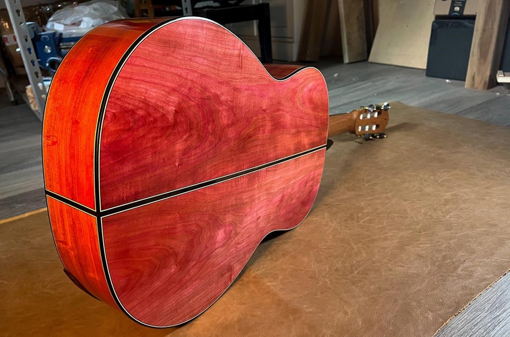 A guitar with red ivory back and sides by one of our customers, Evan Kingma.