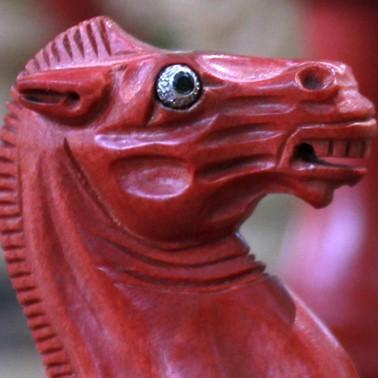 A close-up of the horse, in red ivory hardwood.